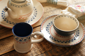 Set of dinnerware on wooden table