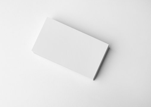 Stack of blank business cards on white background