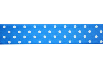 Blue spotted ribbon on light background, close up