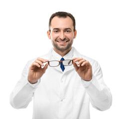 Handsome male doctor with glasses on white background