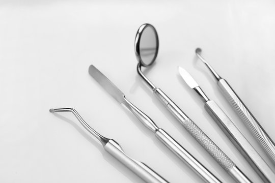 Dentist medical tools on white background