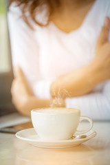 cup of coffee with woman background