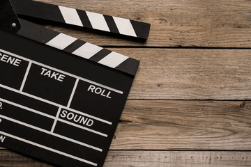Obraz premium movie clapper on wood table