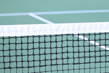 Tennis Net with court in background
