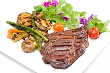 Beef steak with potatoes and Greens