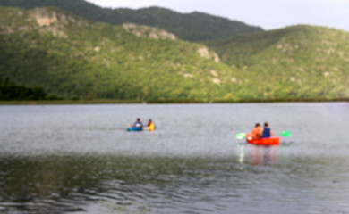 blur focus canoeists boating on lake
