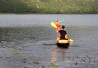 blur focus canoeists boating on lake