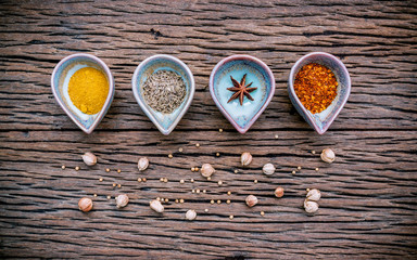 Various herbs and spices in ceramic bowl . Food and cuisine ingr