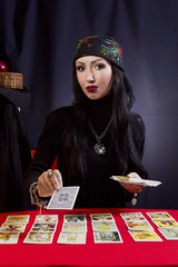 Gypsy woman wonders on Tarot cards