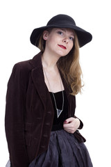 Fototapeta premium Portrait of a young woman in a hat