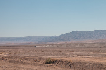 Off-road vehicle driving through Atacama Desert, Chile.