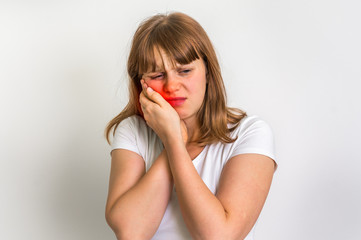 Woman suffering from toothache isolated on white