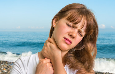 Woman having pain in her neck
