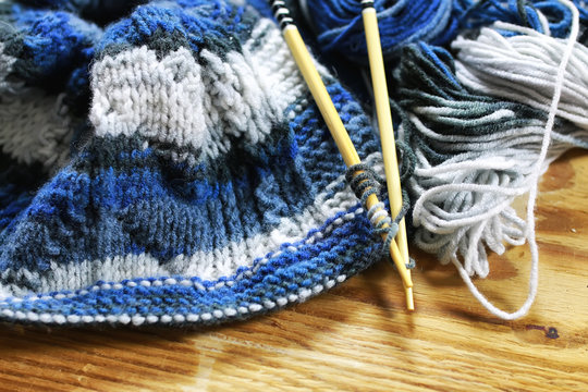 wool and knitting needles basket