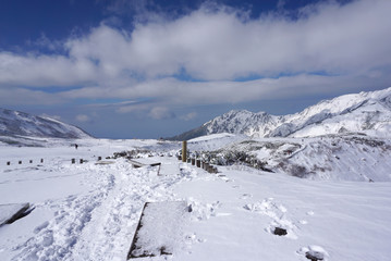 Fototapeta na wymiar Mudoro field in November with snow mountain background
