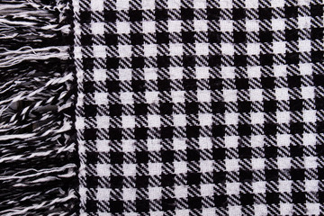 Background with black and white checkered scarf. - 130966995