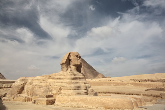The Sphinx at Giza and pyramid  
 