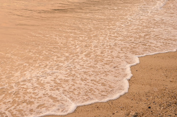 Copy space of smooth wave beach and sand texture background.