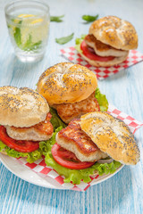 chicken burger with tomato, salad