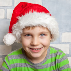 Little boy with a Santa hat