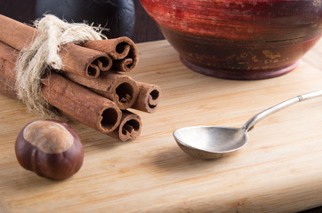 Bunch of cinnamon sticks and vintage silver spoon