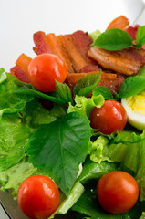 Cherry tomatoes, herbs, olive oil, eggs and bacon