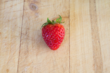 Fresh strawberries on wood. 