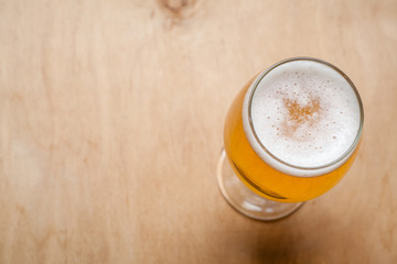Light beer on wood