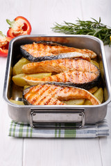 Grilled salmon steak with potatoes