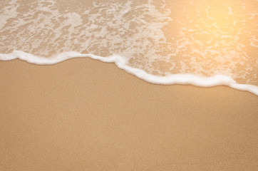 Fototapeta na wymiar Close up tropical beach with smooth wave and sand texture background.