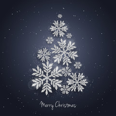 Fototapeta na wymiar Vector Christmas New Year greeting card with sparkling glitter silver textured snowflakes make Christmas tree shape. Seasonal holidays background