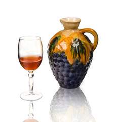 glass of wine and ceramic decanter