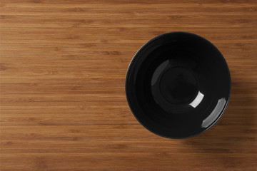 Black plate on a wooden table