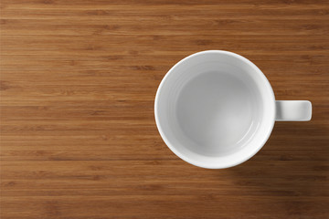 White coffee cup on a wooden table