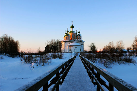 Olonets, Karelia, view of the town park and orthodox church in winter sunset