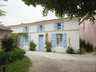 White old house with blue touch like sea side