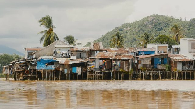 Slums in Nha Trang. Houses on the river. Vietnam.