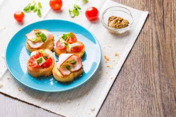 Bruschetta with tomato, cheese and bacon