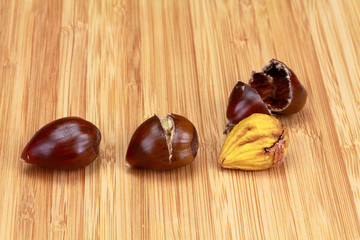 Raw cooked and peeled chestnut with husk