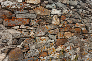 Fototapeta premium a wall built up with stones