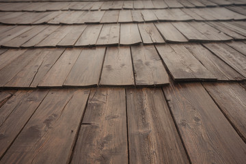 Natural pine wood panels from a wooden roof of a mountain stable