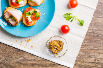 Bruschetta with tomato, cheese and bacon