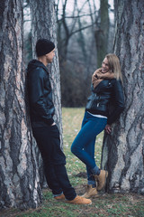 Cute couple in the park, young happy couple have fun in the park