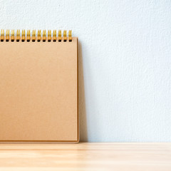 Blank book brown color for copy space on the table wood