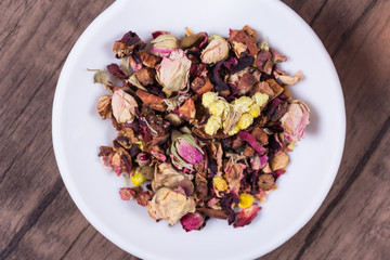 A Pile of Mix Flower Tea on a White Plate