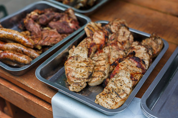 Grill steaks on metal grate, barbecue