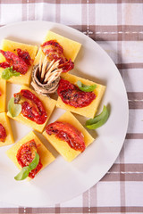 appetizer,polenta with dry tomato and basil