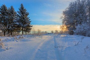 Winter snow landscape with sky and Sun