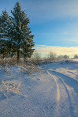 Winter snow landscape with sky and Sun