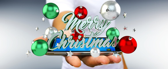 Businessman holding floating christmas message 3D rendering